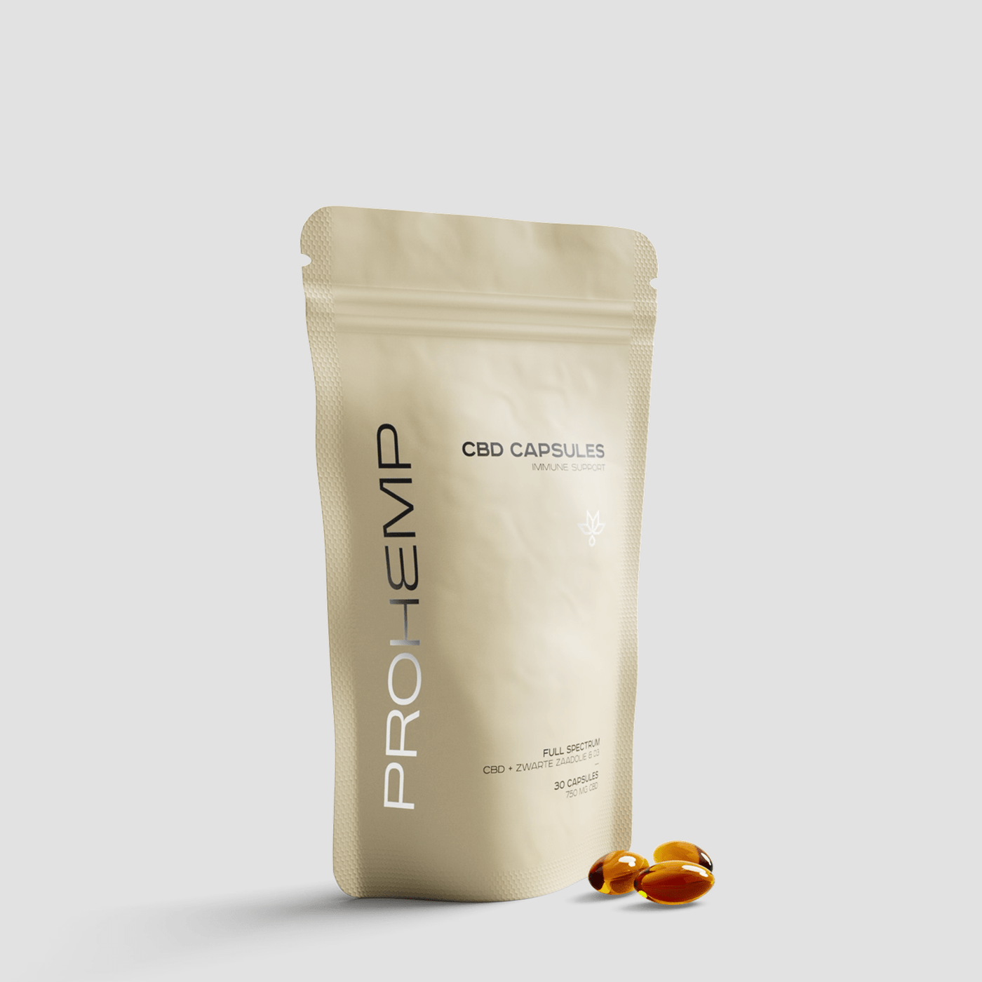 Beige resealable pouch labeled CBD capsules immune support with three softgel capsules in front.